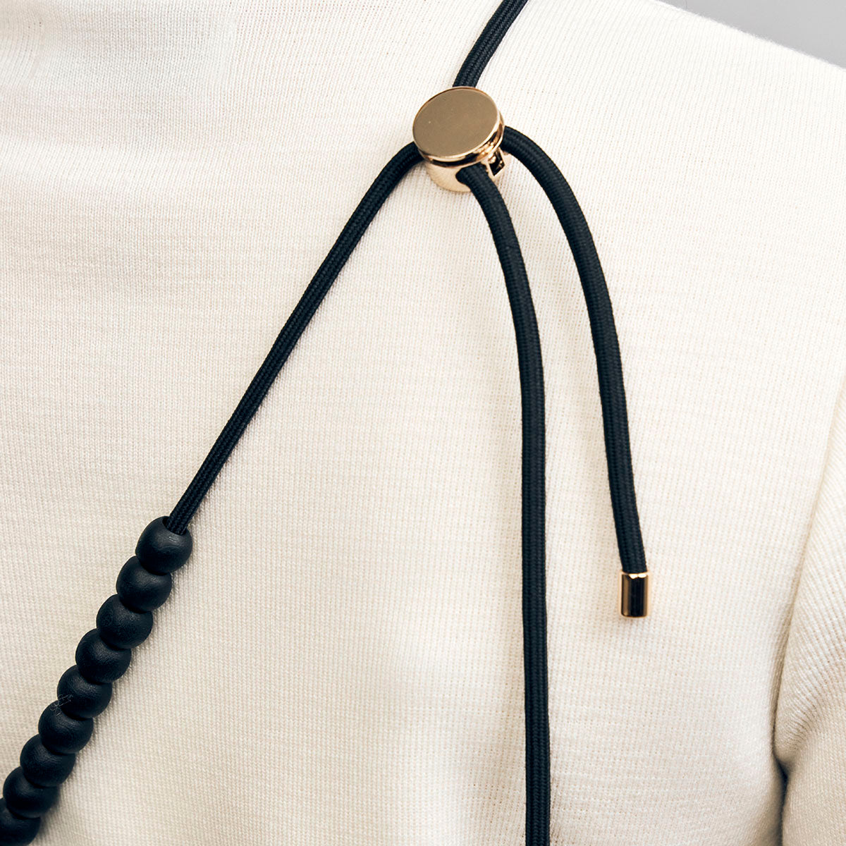 Naomi phone strap, black and gold
