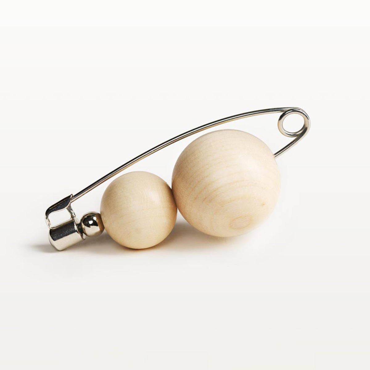 Olos brooch, varnished wood