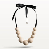 Gaala necklace, varnished wood